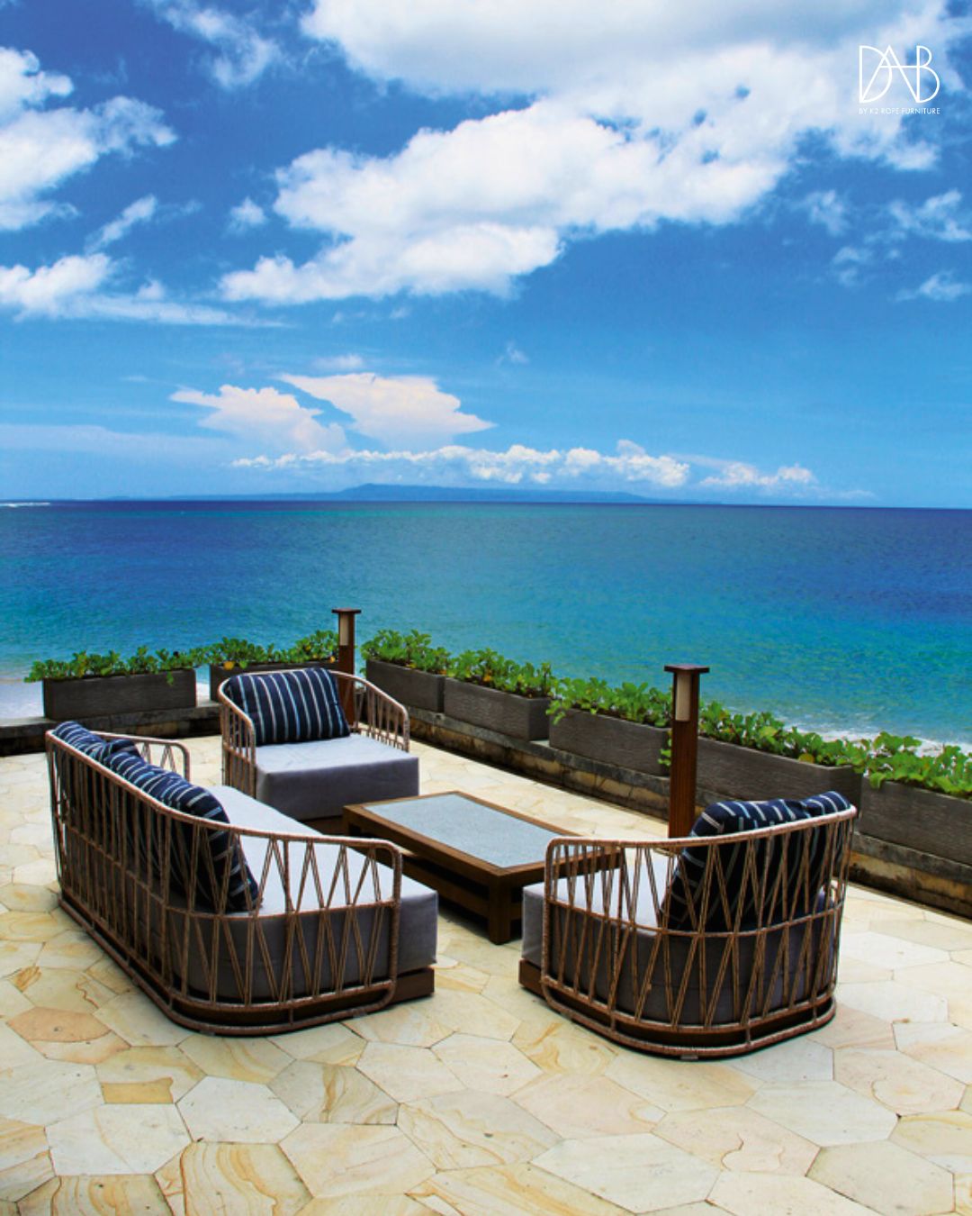 Furniture set on terrace facing the sea